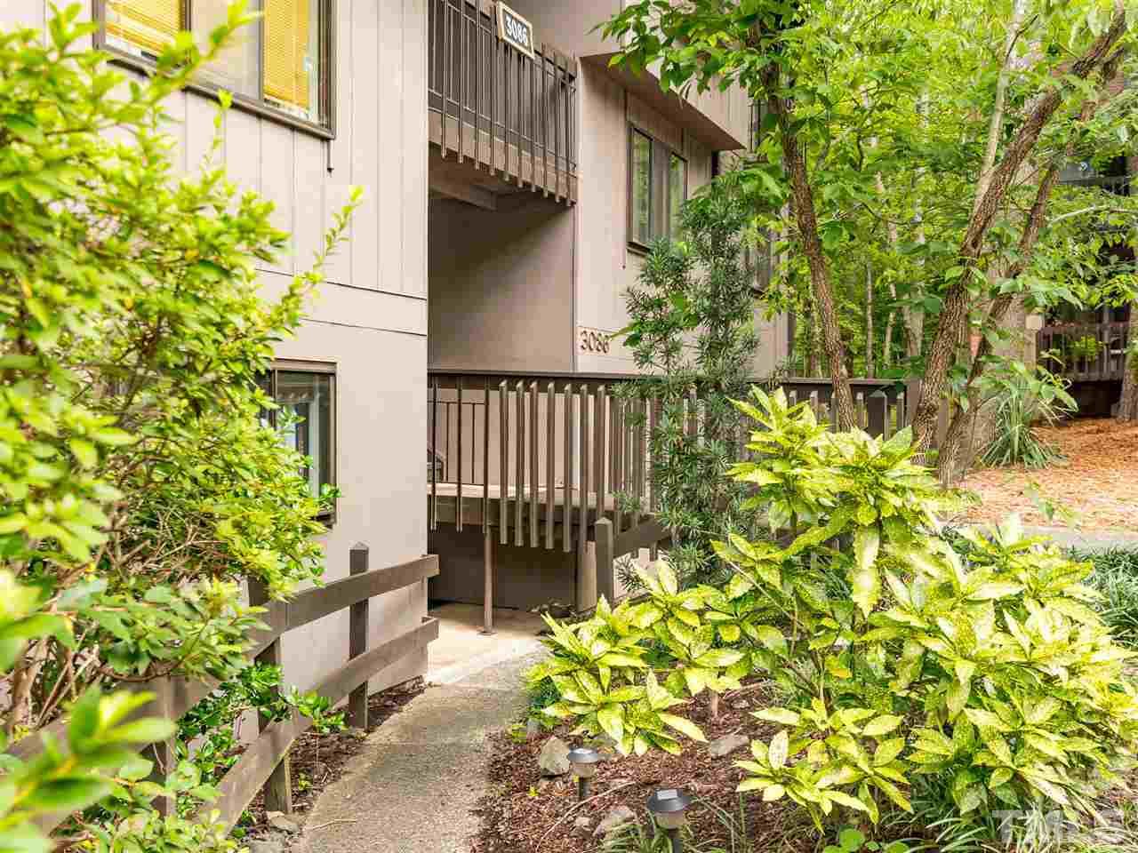 a view of a house with a flower garden