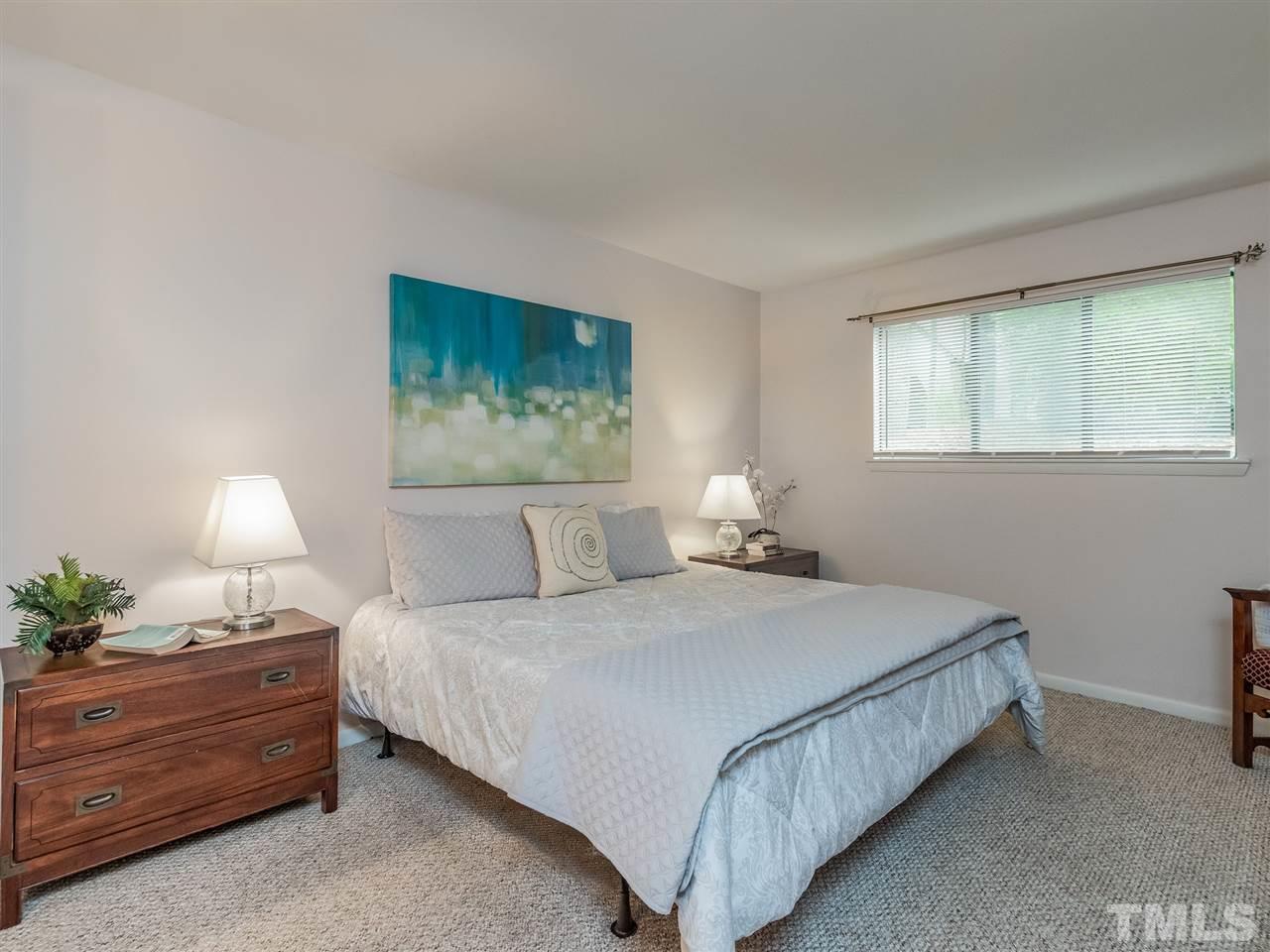 3086 Colony Road, Unit B Durham, NC 27705 - Photo 16 of 27 a bedroom with a bed lamp and window