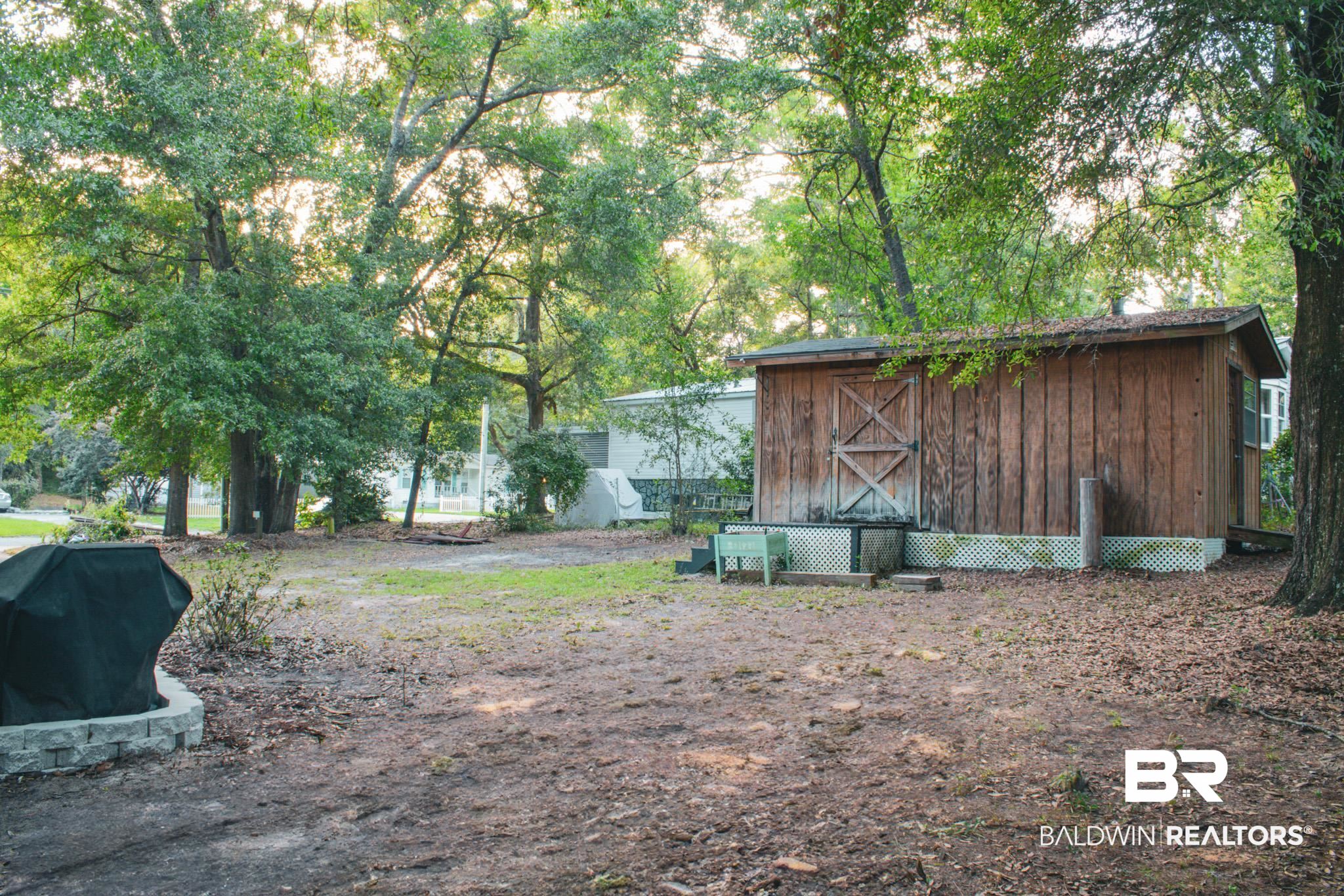 1563 Valencia Drive Lillian, AL 36549 - Photo 4 of 27 View of yard with an outdoor structure