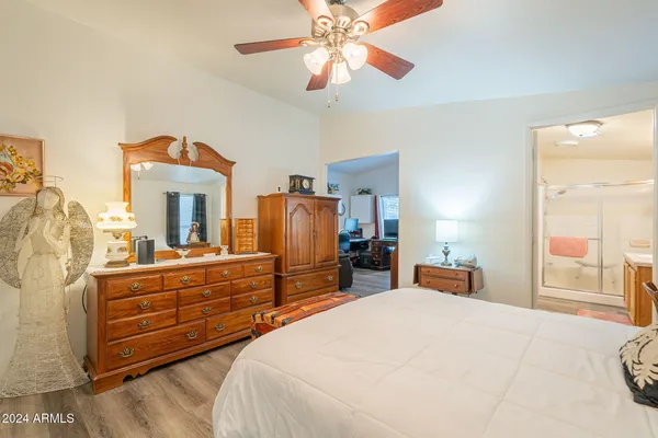 a bed room with a bed and a chandelier