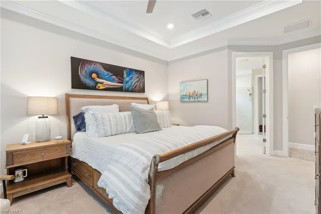 a bedroom with a bed and a lamp