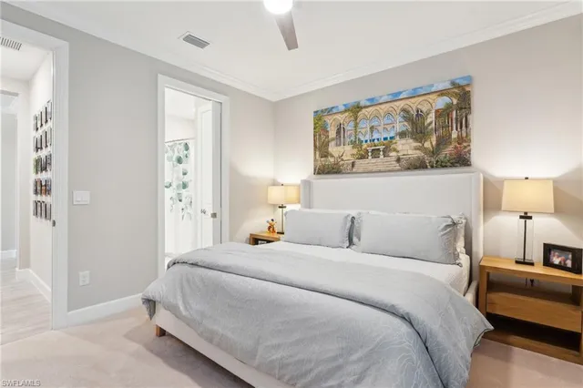 a bedroom with a bed and a painting on the wall