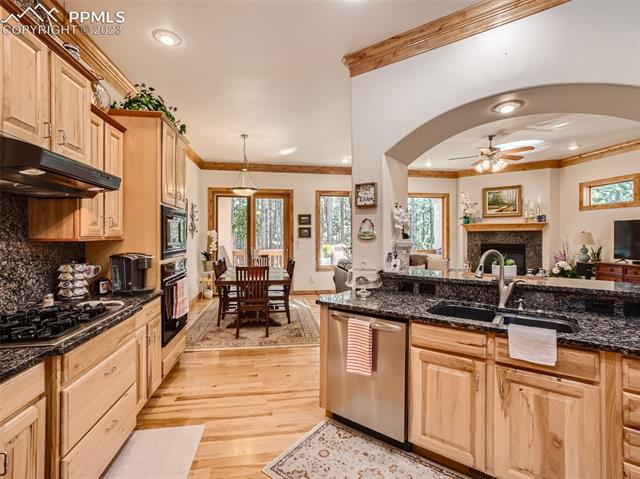 17794 Sawmill Road Colorado Springs, CO 80908 - Photo 11 of 29 Kitchen looking out to Deck