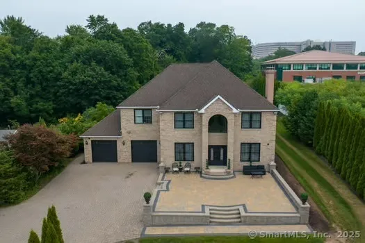 a view of house with yard outdoor seating and entertaining space