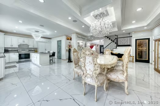 93 South Road Farmington, CT 06032 - Photo 11 of 40 a kitchen with stainless steel appliances kitchen island granite countertop a refrigerator and microwave