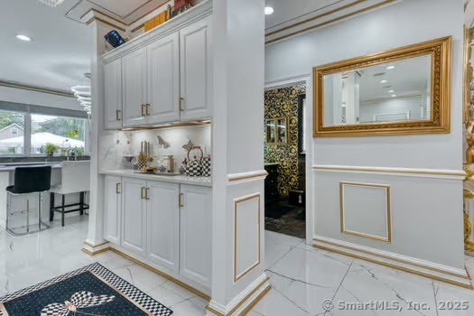 93 South Road Farmington, CT 06032 - Photo 14 of 40 a kitchen with white cabinets and table