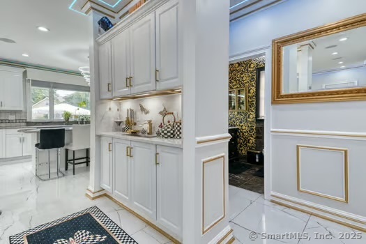 93 South Road Farmington, CT 06032 - Photo 21 of 40 a kitchen with white cabinets and window
