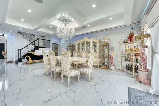 93 South Road Farmington, CT 06032 - Photo 23 of 40 a view of a livingroom with furniture and a chandelier