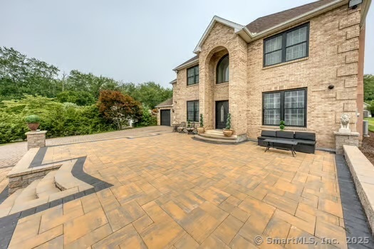 93 South Road Farmington, CT 06032 - Photo 3 of 40 a view of a house with a patio