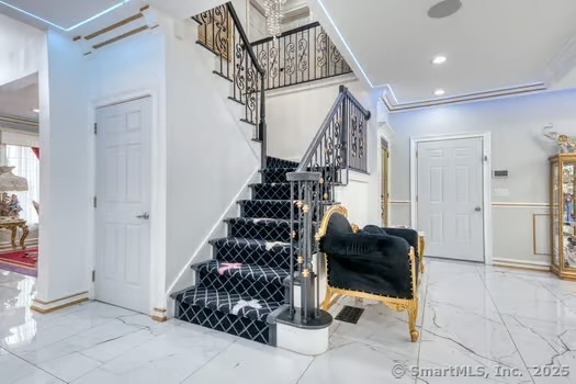 93 South Road Farmington, CT 06032 - Photo 31 of 40 a view of entryway with stairs and furniture