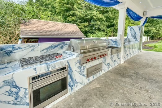 93 South Road Farmington, CT 06032 - Photo 36 of 40 an outdoor space with seating area and trees