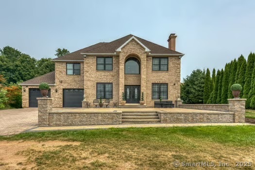 93 South Road Farmington, CT 06032 - Photo 4 of 40 a front view of a house with a yard