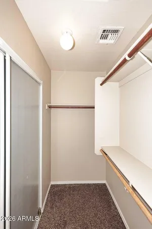 a view of an empty walk in closet