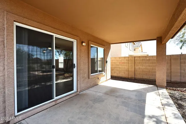 a view of backyard with large windows