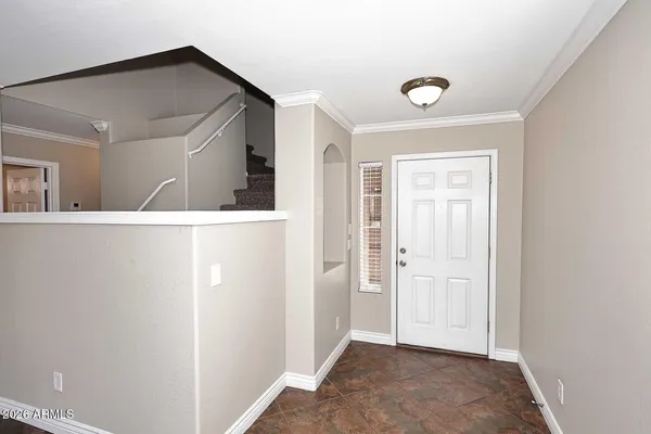 a view of a livingroom with wooden floor and cabinet