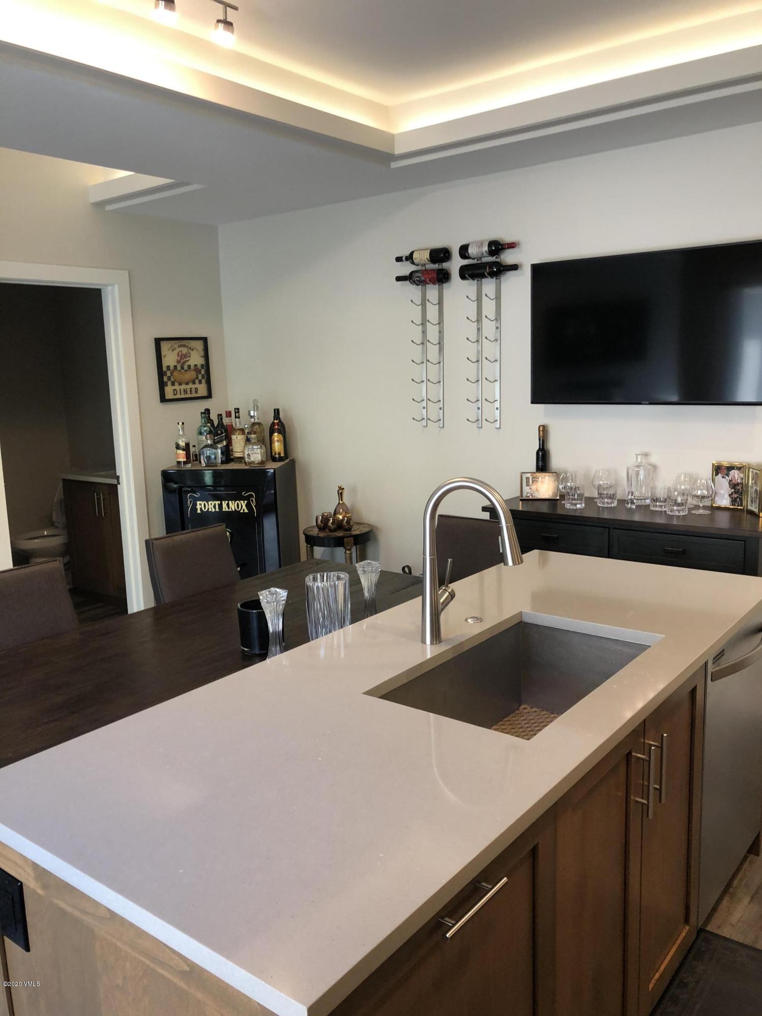 316 Wall Street, Unit 6 Eagle, CO 81631 - Photo 11 of 30 a kitchen with a sink and a refrigerator