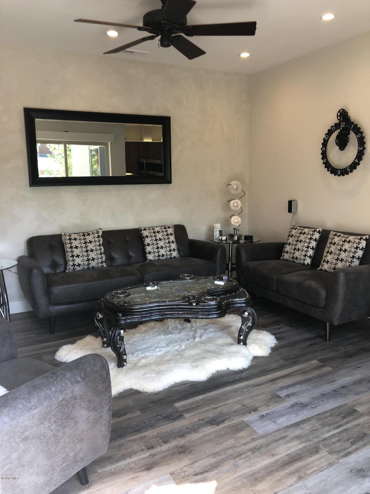 316 Wall Street, Unit 6 Eagle, CO 81631 - Photo 12 of 30 a living room with furniture and a wooden floor