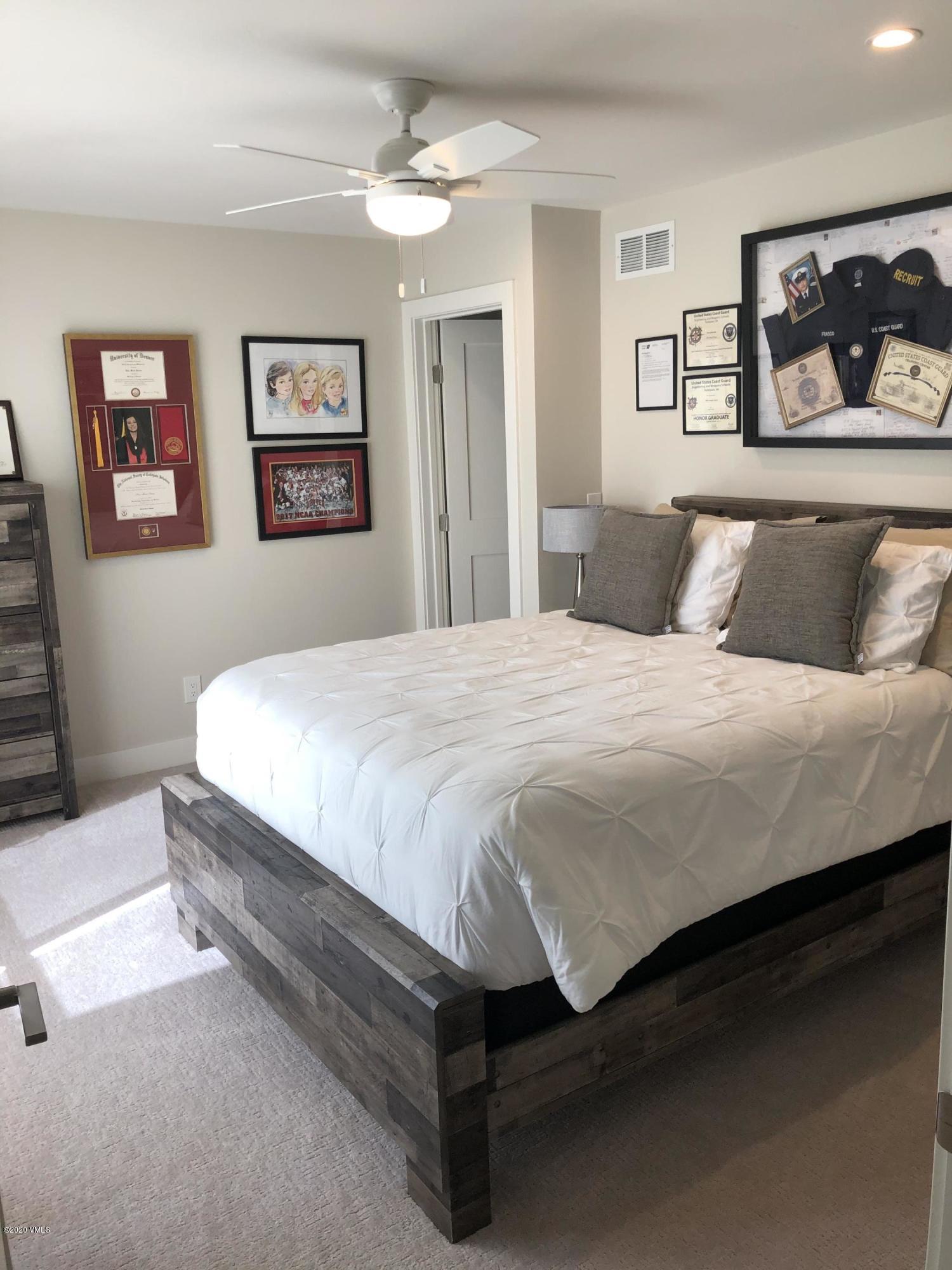 316 Wall Street, Unit 6 Eagle, CO 81631 - Photo 15 of 30 a bedroom with a bed and wall painting