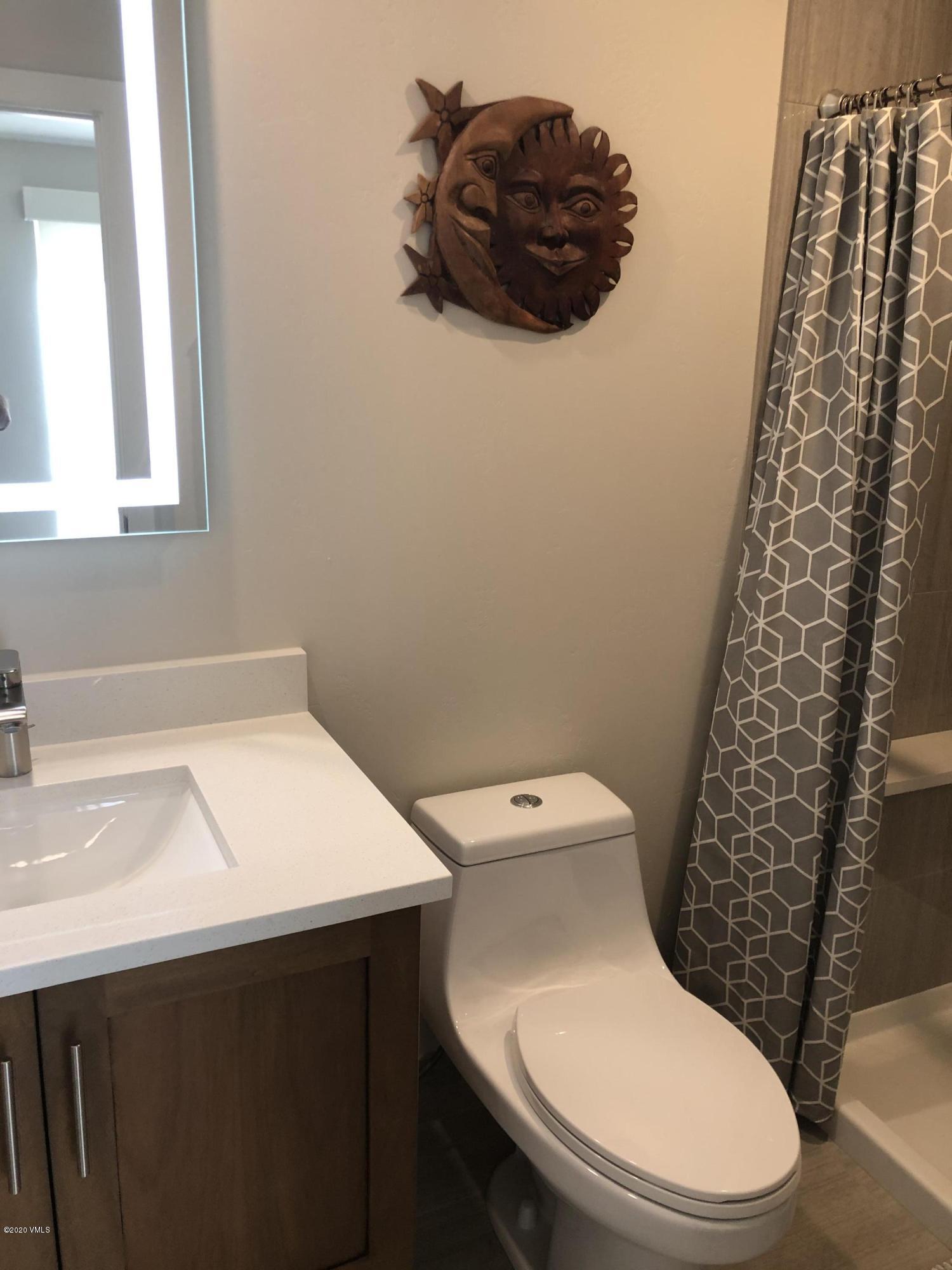 316 Wall Street, Unit 6 Eagle, CO 81631 - Photo 18 of 30 a white toilet sitting next to a bathroom sink