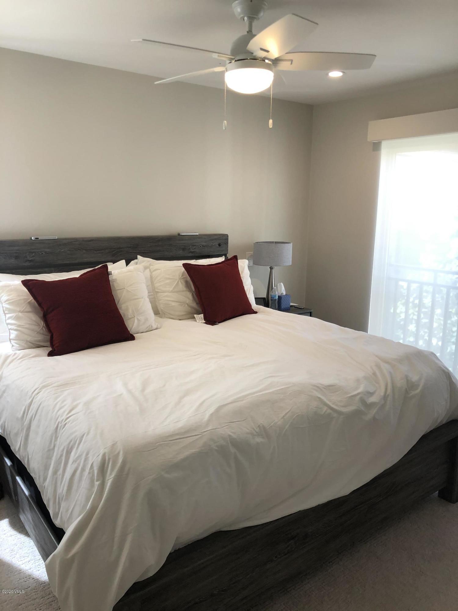 316 Wall Street, Unit 6 Eagle, CO 81631 - Photo 21 of 30 a bedroom with a bed and a night stand