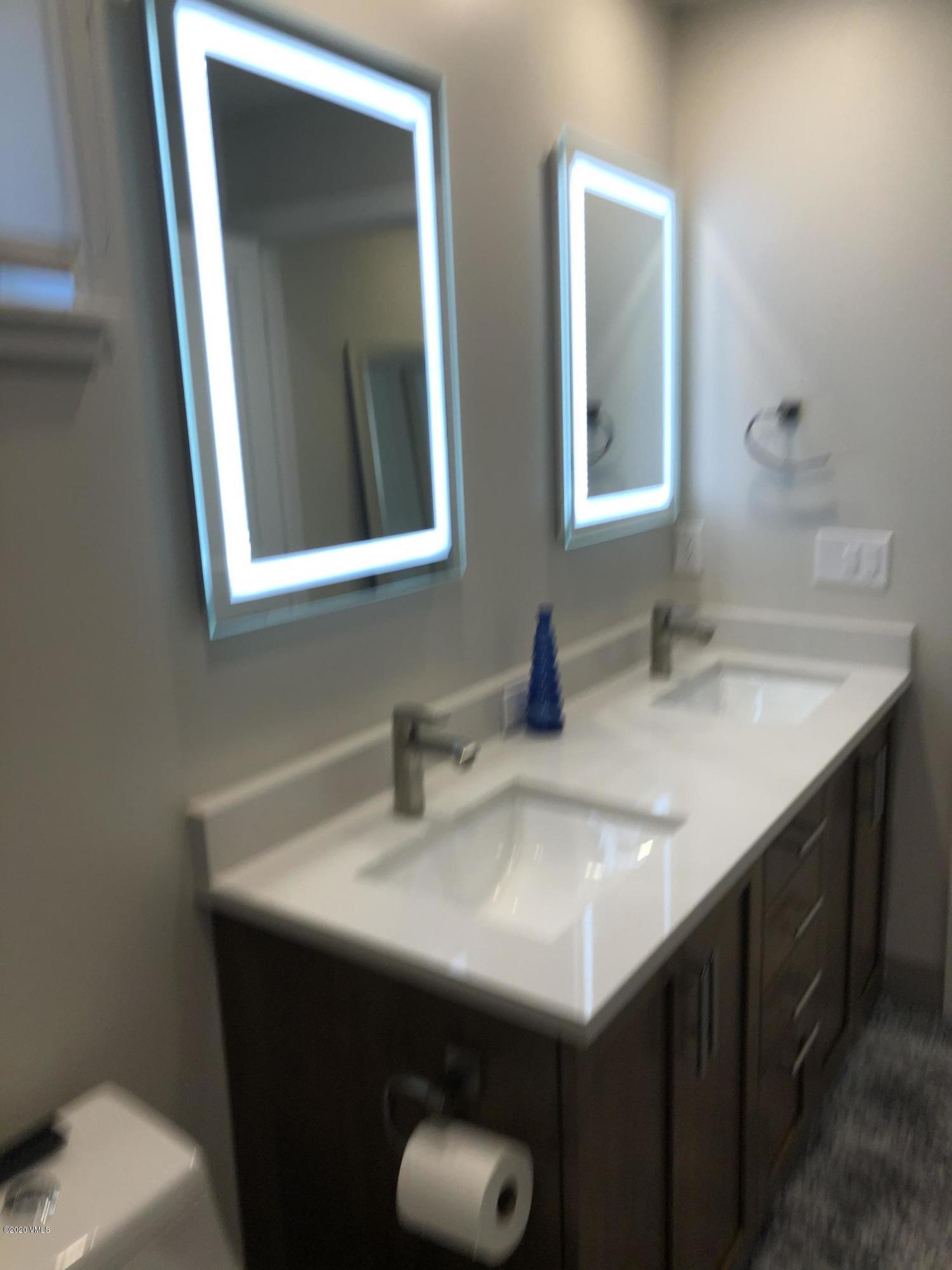 316 Wall Street, Unit 6 Eagle, CO 81631 - Photo 23 of 30 a bathroom with a sink and a mirror