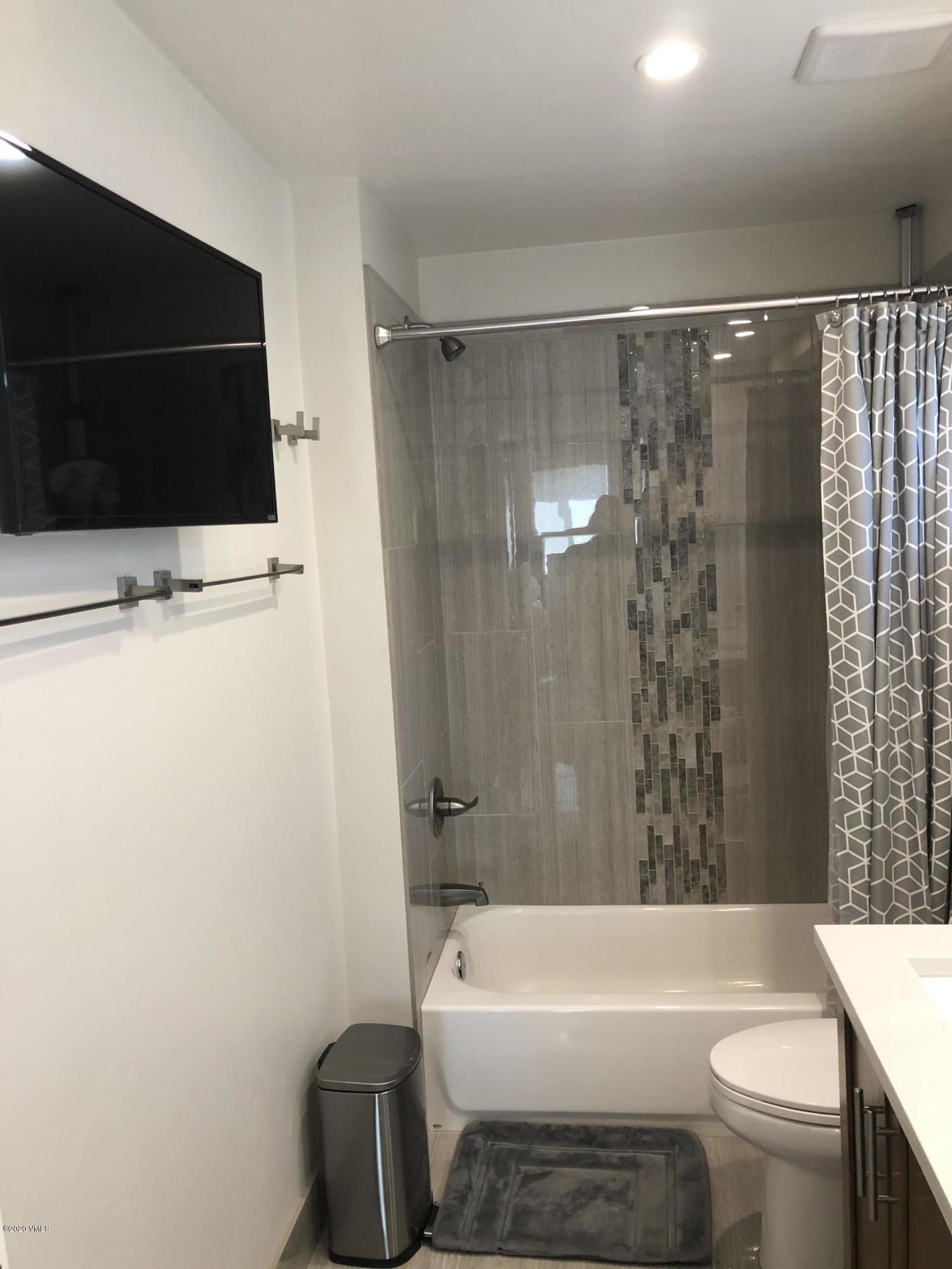 316 Wall Street, Unit 6 Eagle, CO 81631 - Photo 24 of 30 a bathroom with a toilet a sink and bathtub