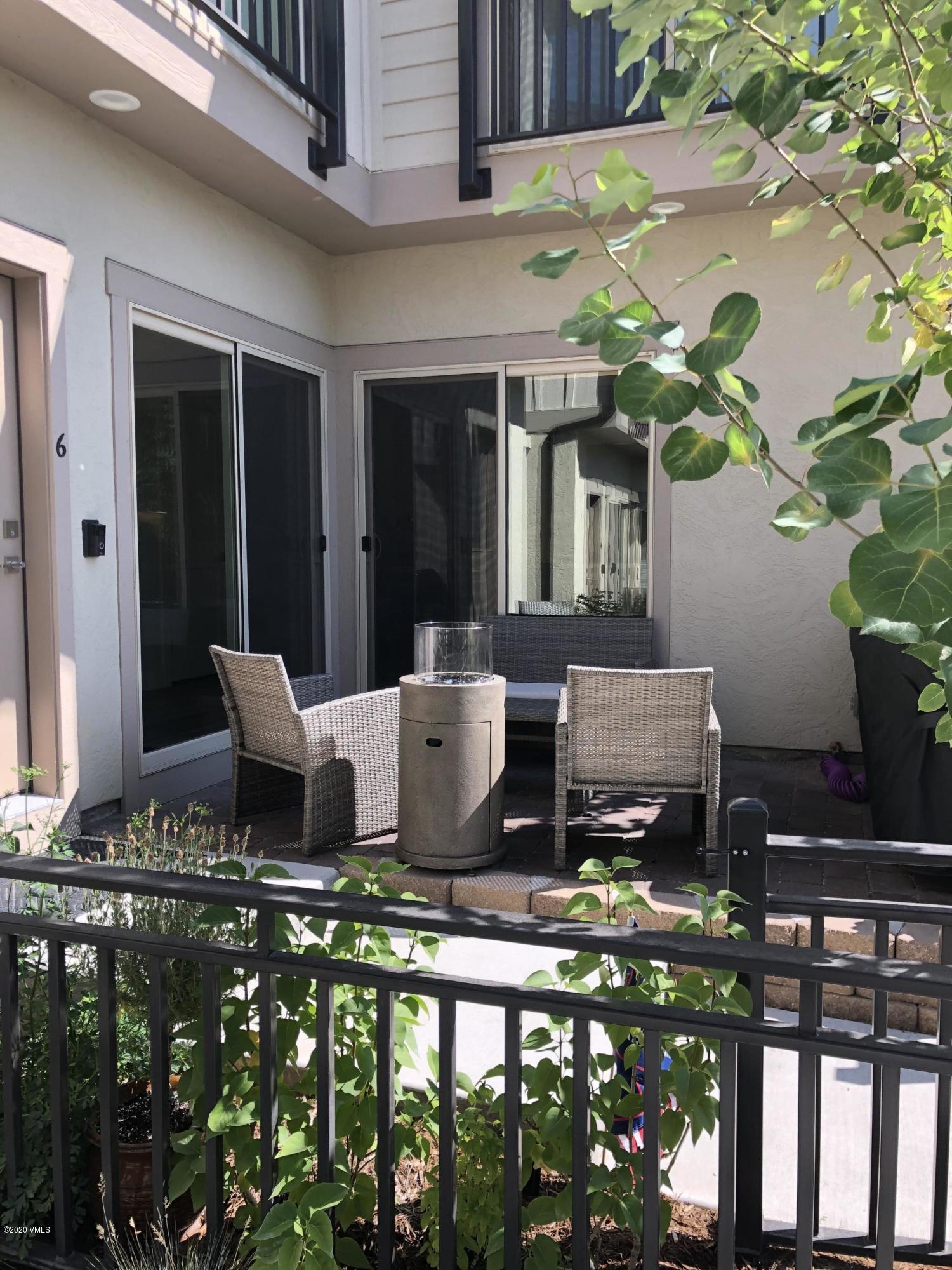 316 Wall Street, Unit 6 Eagle, CO 81631 - Photo 3 of 30 a roof deck with table and chairs potted plants