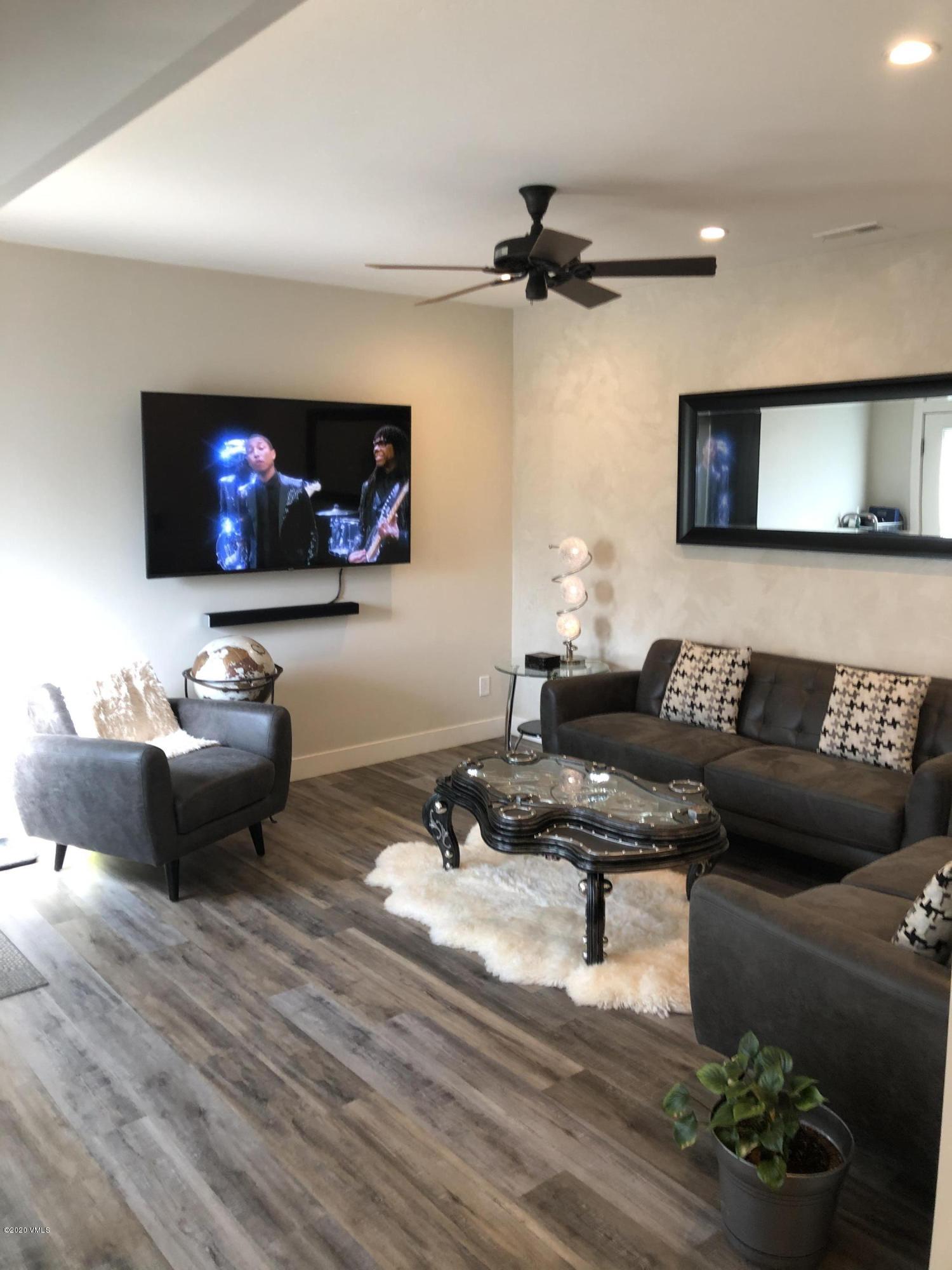 316 Wall Street, Unit 6 Eagle, CO 81631 - Photo 6 of 30 a living room with furniture and a flat screen tv