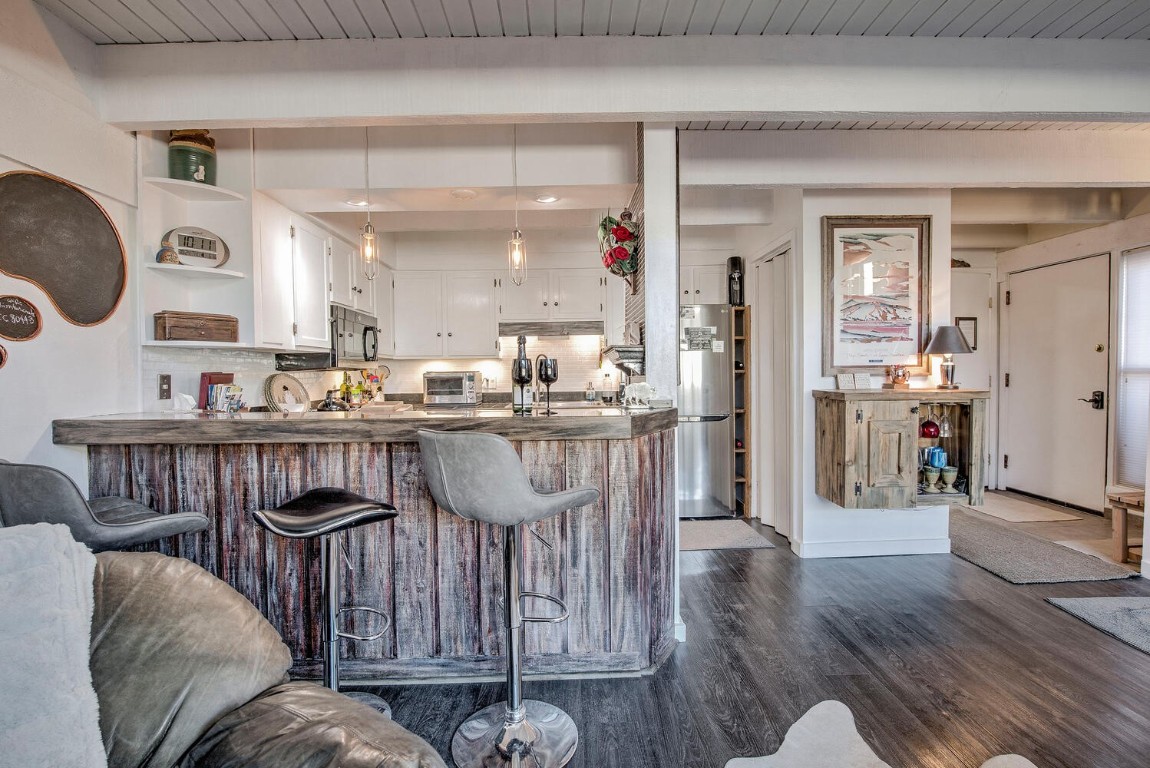 78 Guller Road, Unit 201 Copper Mountain, CO 80443 - Photo 12 of 41 a living room with furniture a wooden floor and a kitchen view