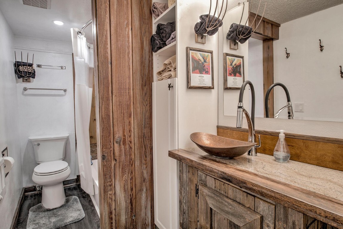 78 Guller Road, Unit 201 Copper Mountain, CO 80443 - Photo 17 of 41 a bathroom with a granite countertop sink a toilet and a shower