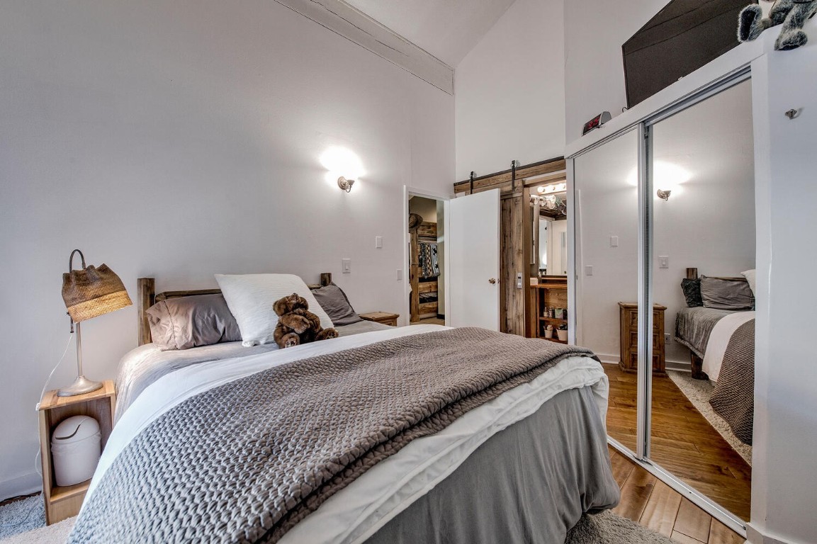 78 Guller Road, Unit 201 Copper Mountain, CO 80443 - Photo 25 of 41 a bedroom with a bed and a mirror