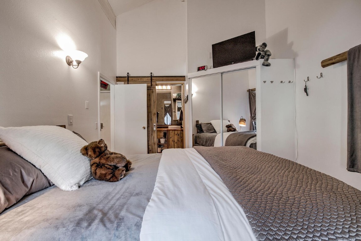 78 Guller Road, Unit 201 Copper Mountain, CO 80443 - Photo 26 of 41 a bed room with a bed and a television