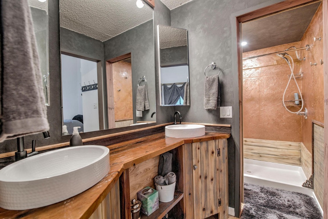 78 Guller Road, Unit 201 Copper Mountain, CO 80443 - Photo 27 of 41 a bathroom with a sink double vanity and a mirror