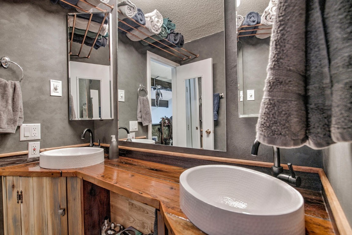 78 Guller Road, Unit 201 Copper Mountain, CO 80443 - Photo 28 of 41 a bathroom with a sink a mirror and a toilet