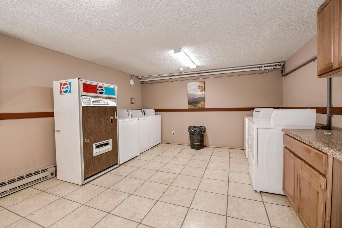 78 Guller Road, Unit 201 Copper Mountain, CO 80443 - Photo 40 of 41 a kitchen with stainless steel appliances granite countertop a refrigerator and a sink
