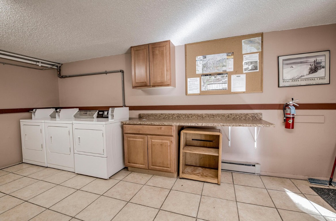 78 Guller Road, Unit 201 Copper Mountain, CO 80443 - Photo 41 of 41 a kitchen with white cabinets appliances and sink