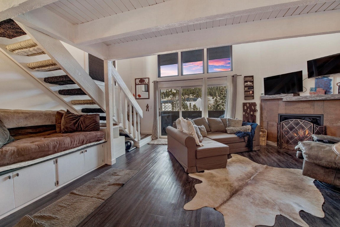 78 Guller Road, Unit 201 Copper Mountain, CO 80443 - Photo 9 of 41 a living room with furniture fireplace and flat screen tv