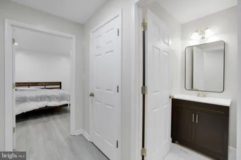 a en suite bathroom with a sink and a mirror
