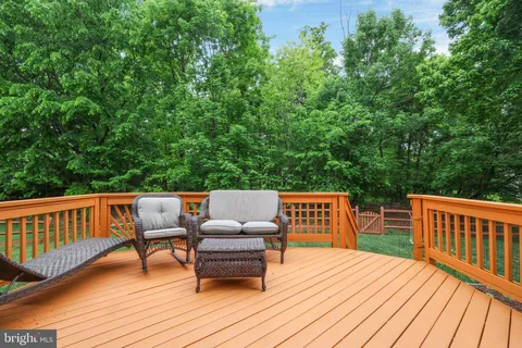a view of a park with wooden fence