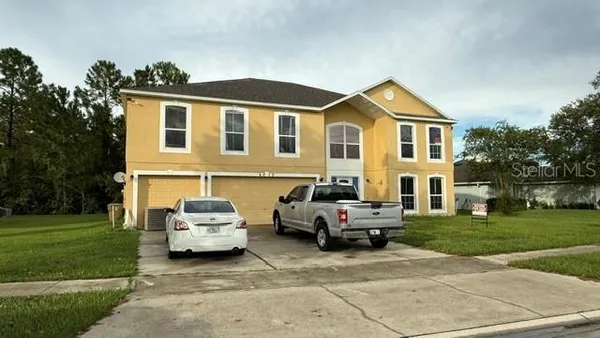 a car parked in front of a house
