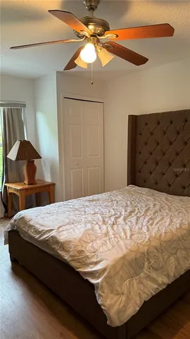 a bedroom with a bed and dresser