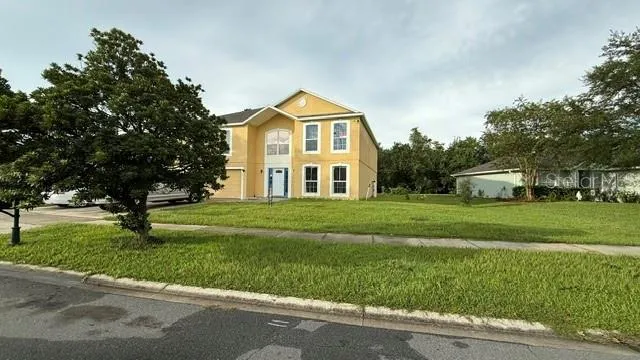 a front view of a house with a yard
