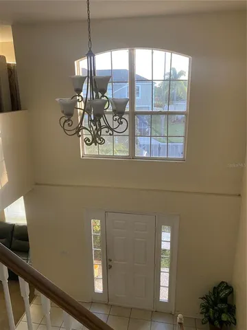 a view of a livingroom with furniture and windows