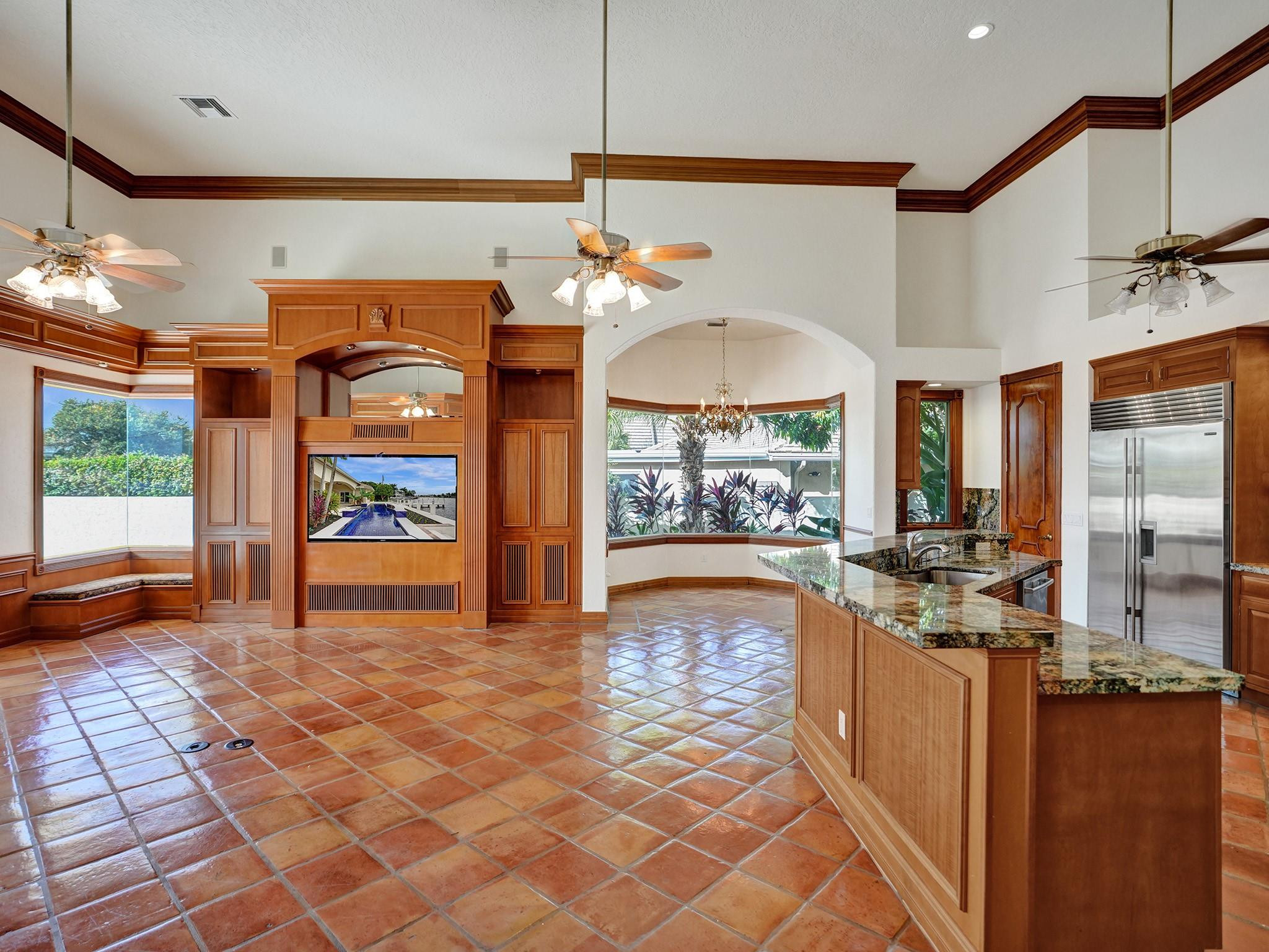 21 Saranac Road Sea Ranch Lakes, FL 33308 - Photo 12 of 35 a view of a kitchen with furniture and a table