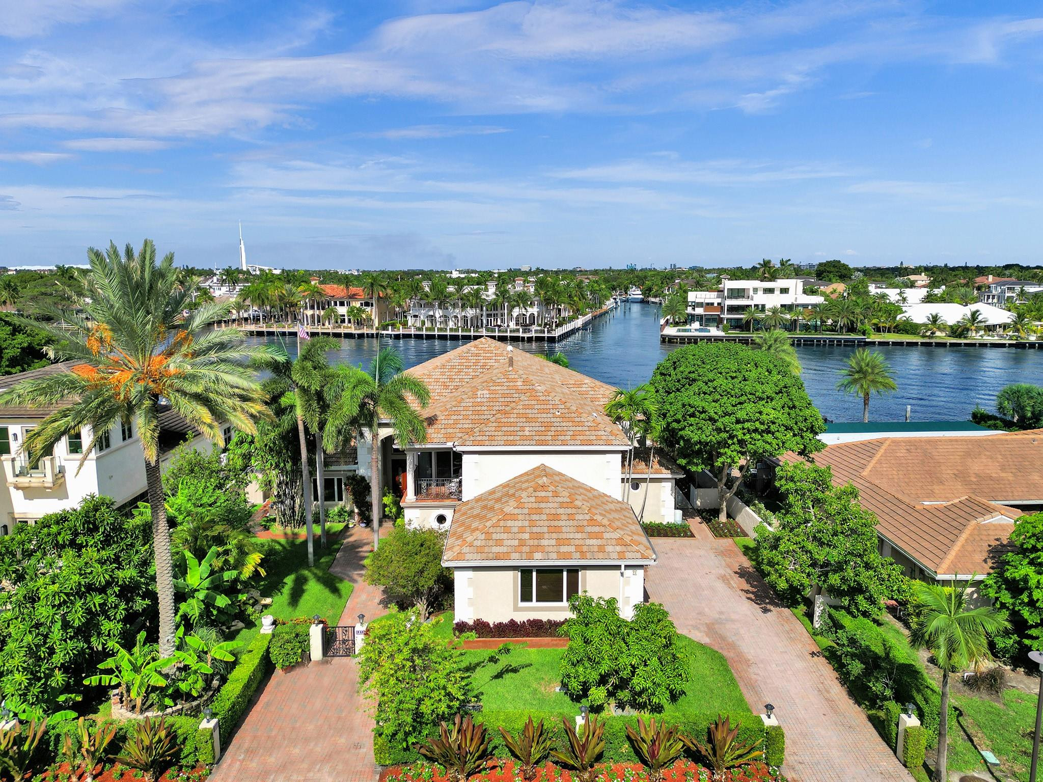 21 Saranac Road Sea Ranch Lakes, FL 33308 - Photo 2 of 35 an aerial view of a house with a garden