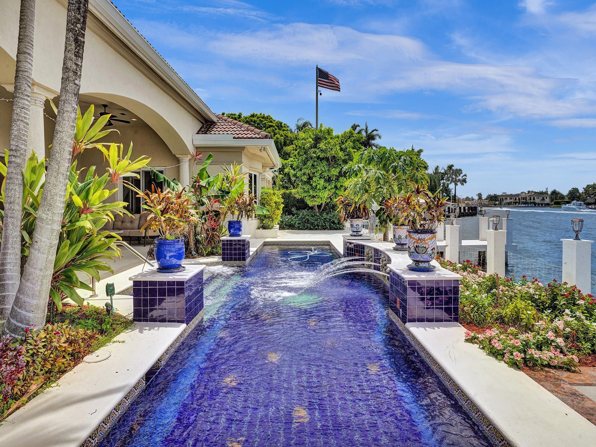 21 Saranac Road Sea Ranch Lakes, FL 33308 - Photo 24 of 35 a front view of a house with garden
