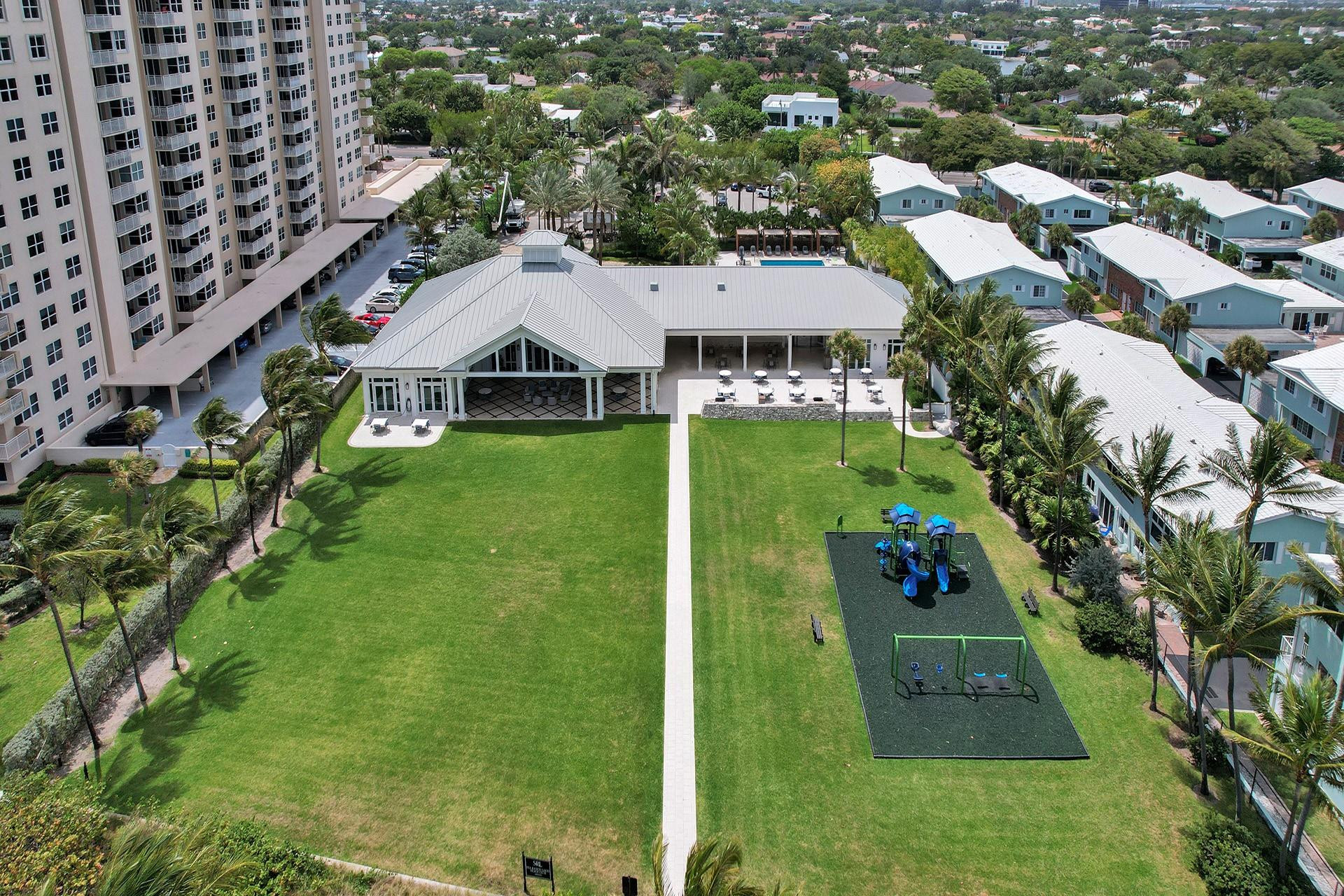 21 Saranac Road Sea Ranch Lakes, FL 33308 - Photo 30 of 35 an aerial view of residential houses with outdoor space and trees