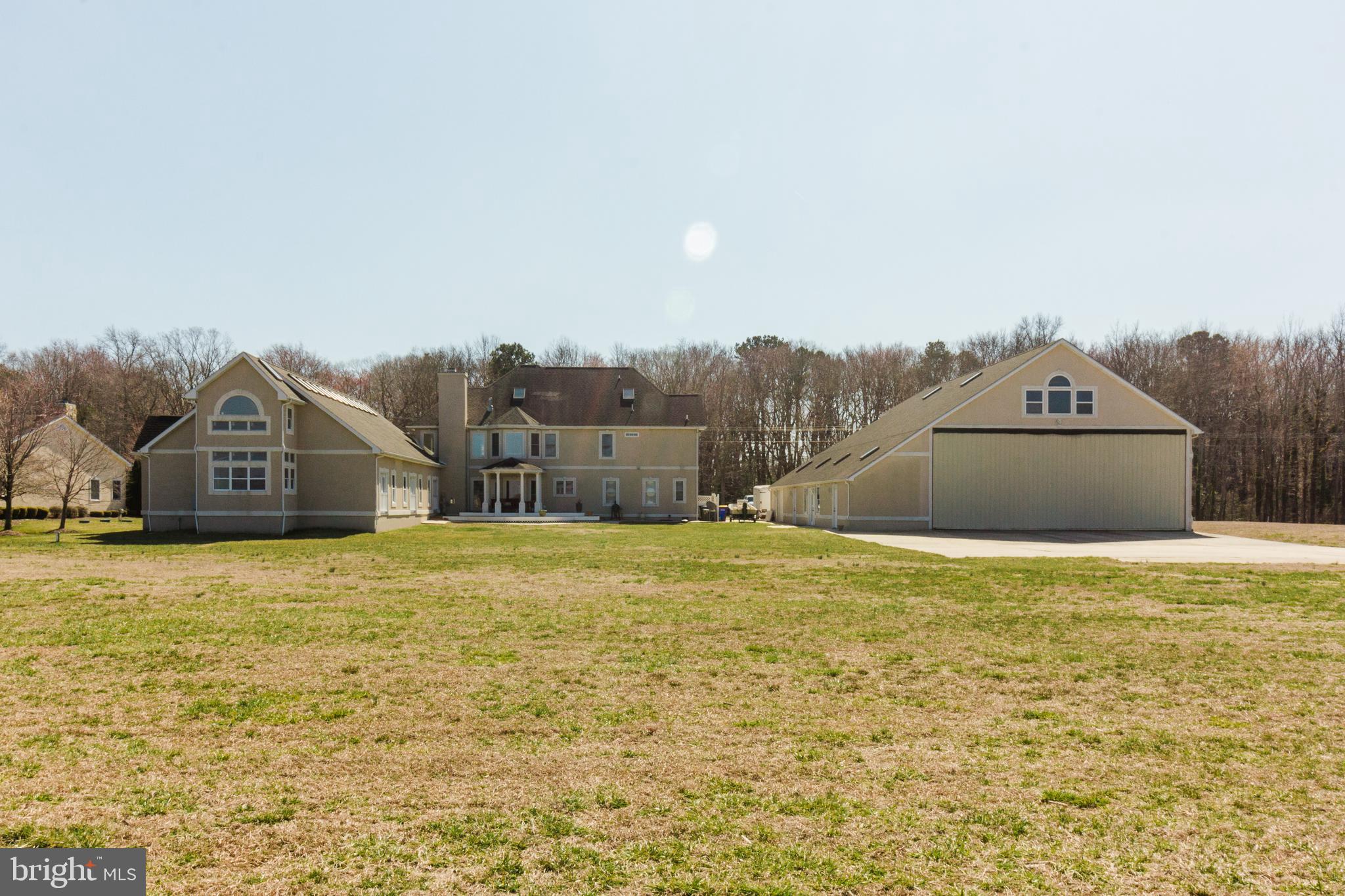 29523 Eagle Crest Road Milton, DE 19968 - Photo 2 of 34 Rear of House, Pool House and Hangar