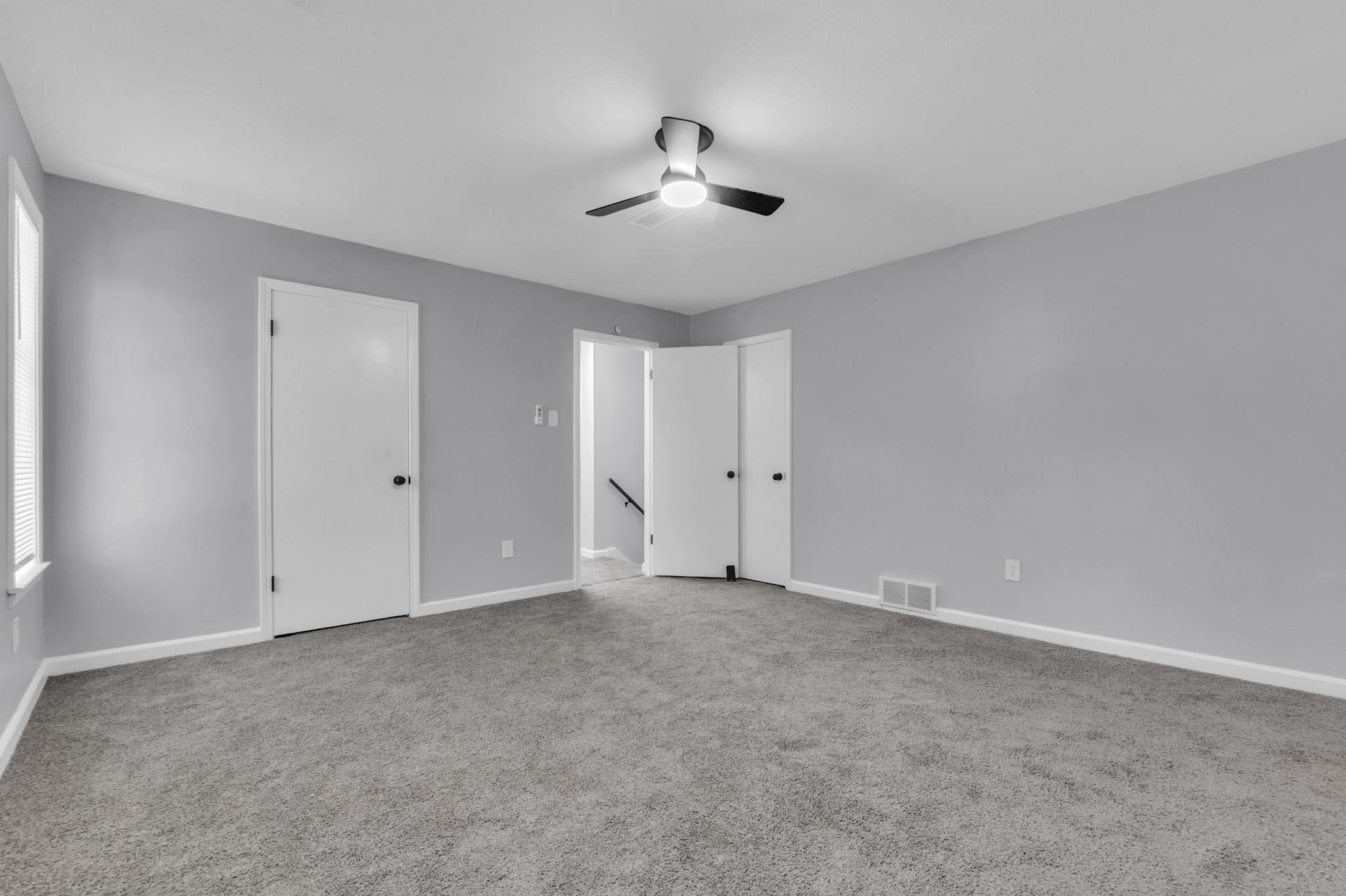 3314 Bright Ridge Cove Memphis, TN 38115 - Photo 12 of 16 Carpeted room featuring light gray walls, white baseboards, and a ceiling fan with integrated lighting