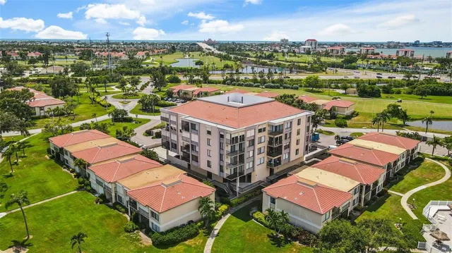 an aerial view of a house with a ocean view
